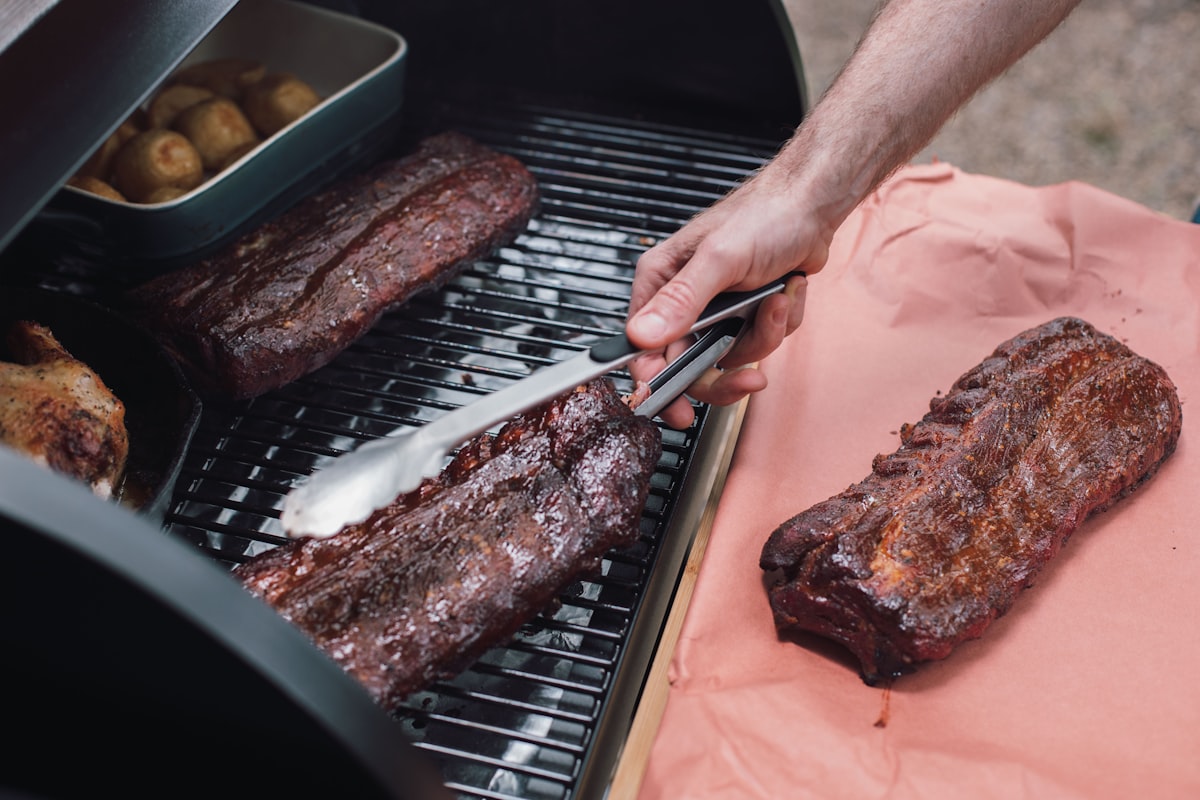 Slicing smoked ribs on a cutting board