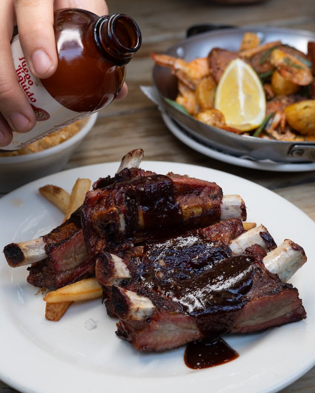 Juicy BBQ ribs drenched in rich barbecue sauce
